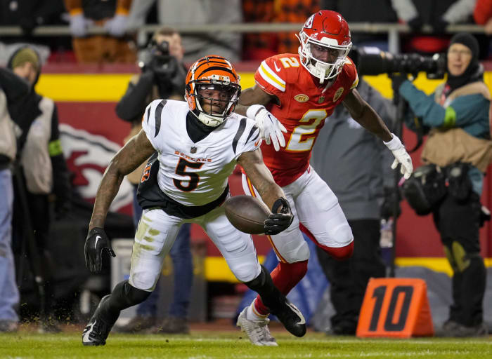 Dec 31, 2023; Kansas City, Missouri, USA; Cincinnati Bengals wide receiver Tee Higgins (5) is unable to make the catch as Kansas City Chiefs cornerback Joshua Williams (2) defends during the second half at GEHA Field at Arrowhead Stadium.